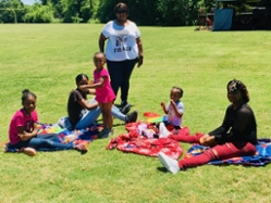 more families enjoying a picnic at kite festival