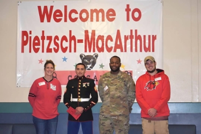 lu student group veterans affairs serve as keynote speakers for Pietzsch-MacArthur Elementary Veterans Day Program