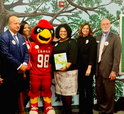 Audrey Collens joins Big Red for Ribbon Cutting at the NEST