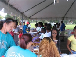 community members enjoy snacks at the day in the park 